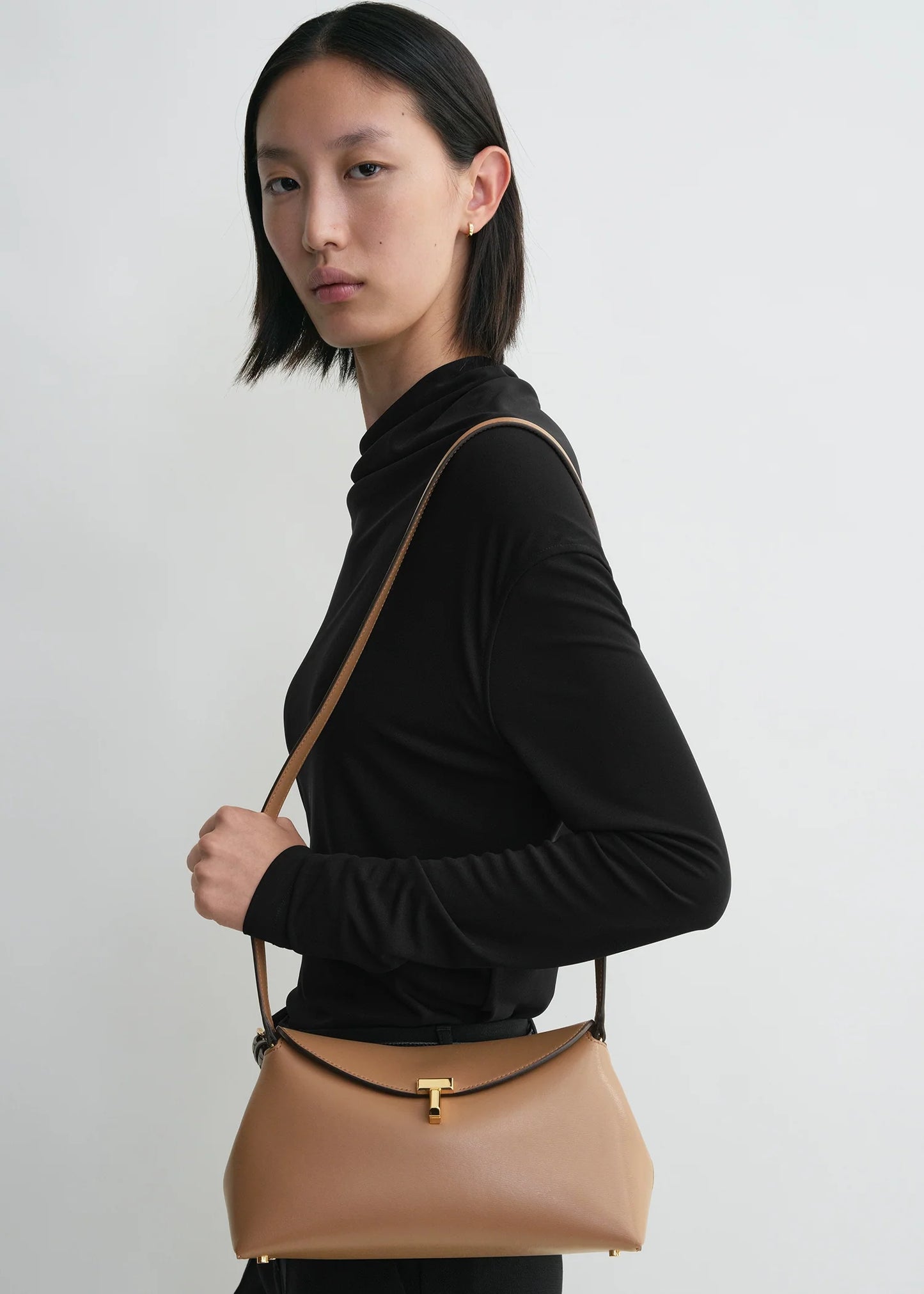 Toteme T-Lock leather clutch camel