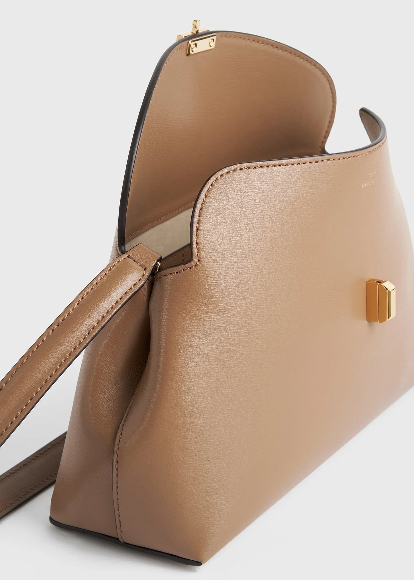 Toteme T-Lock leather clutch camel