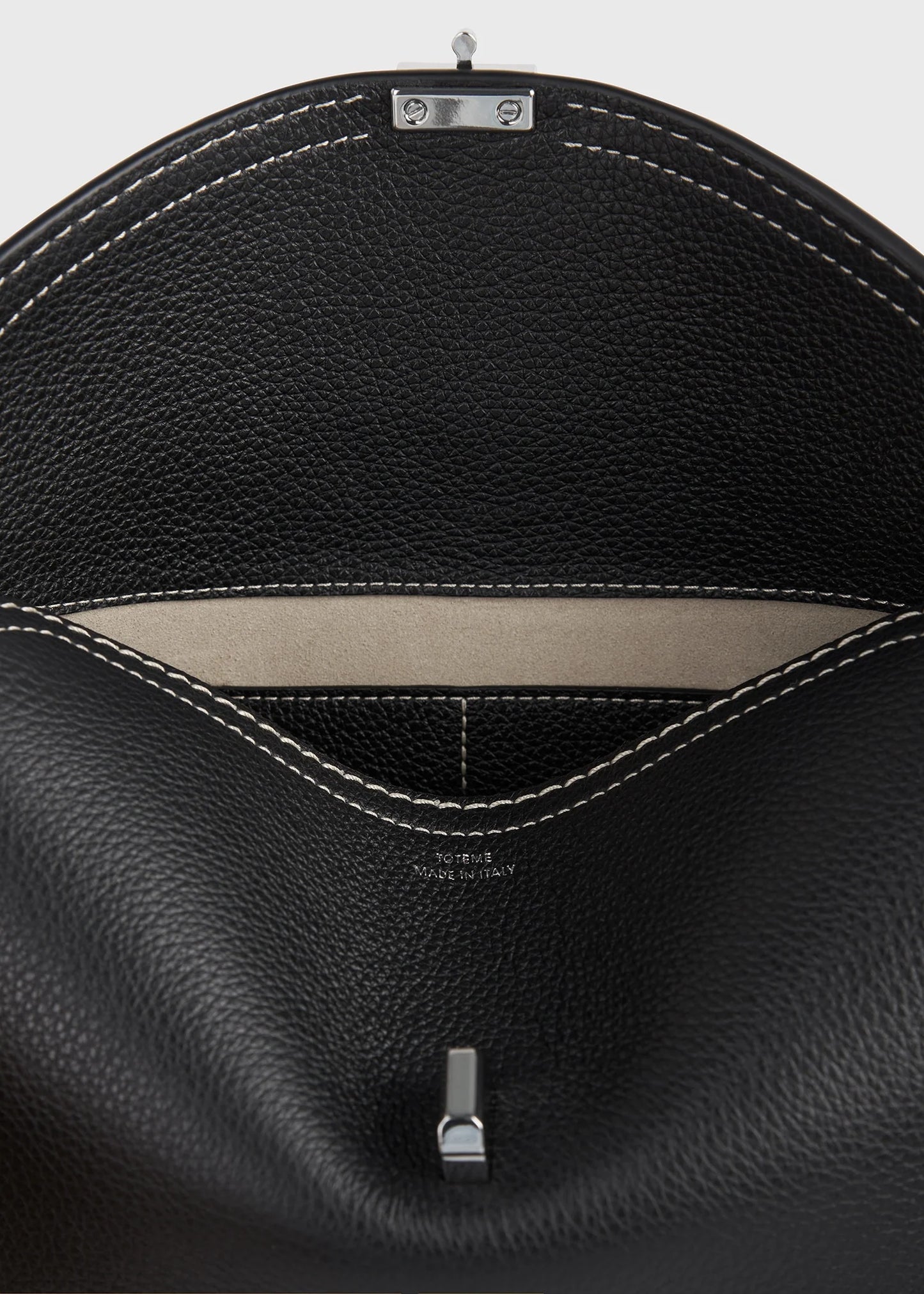 Toteme T-Lock grained-leather clutch black
