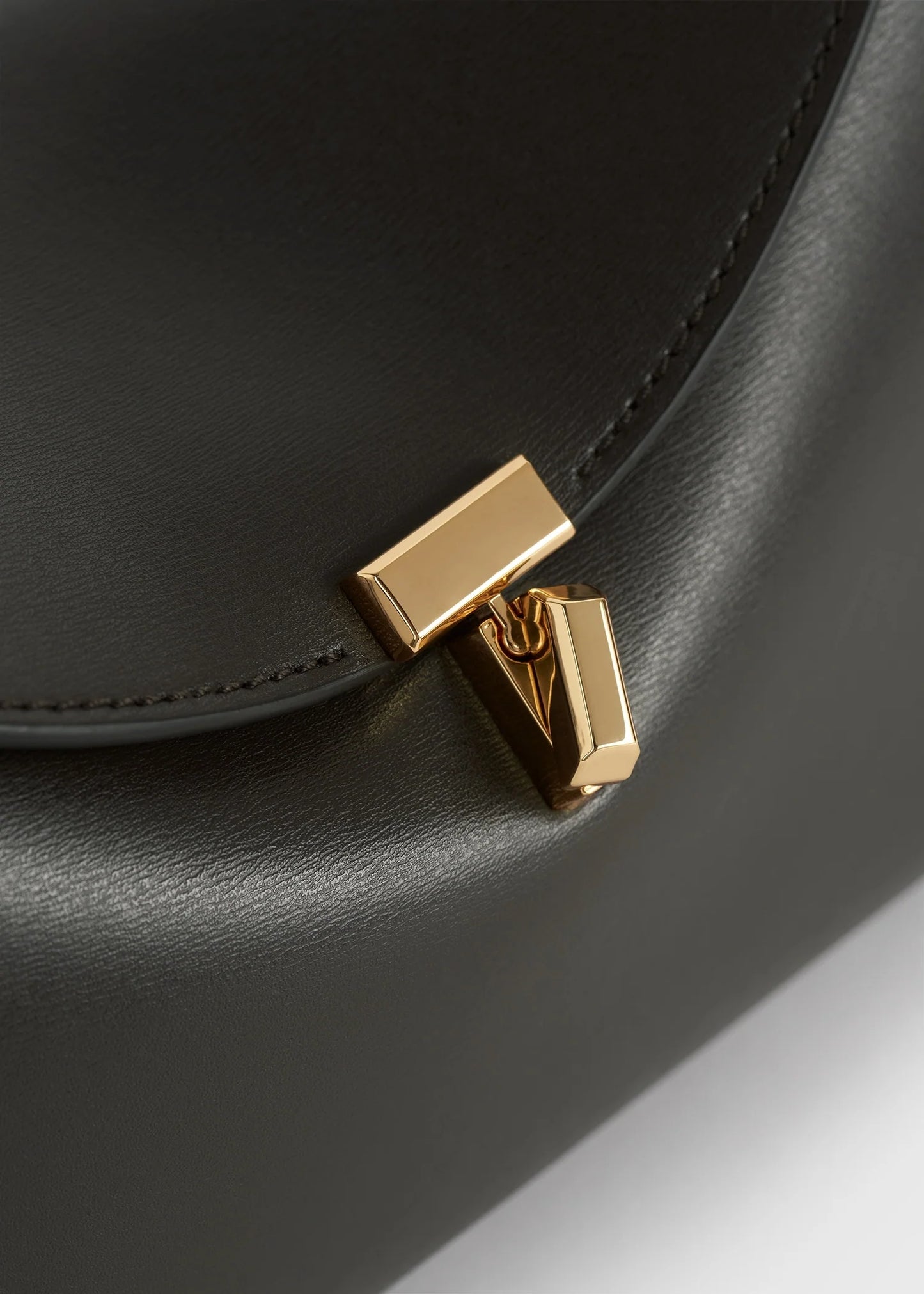 Toteme T-Lock leather clutch bark