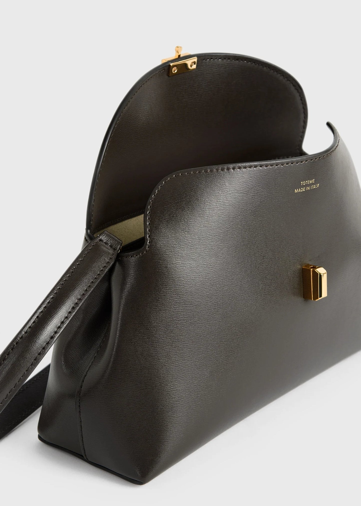 Toteme T-Lock leather clutch bark