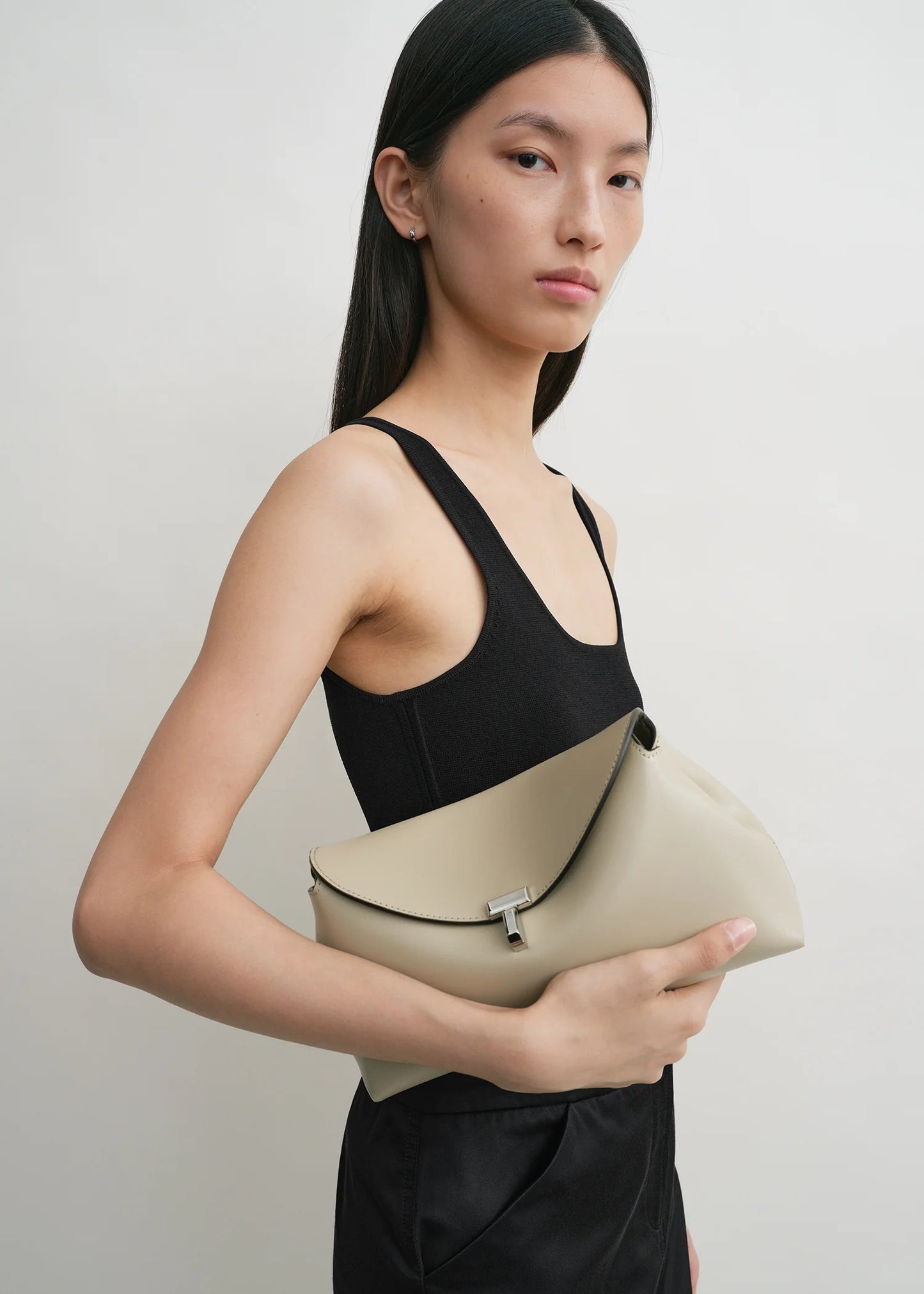 Toteme T-Lock leather clutch fawn